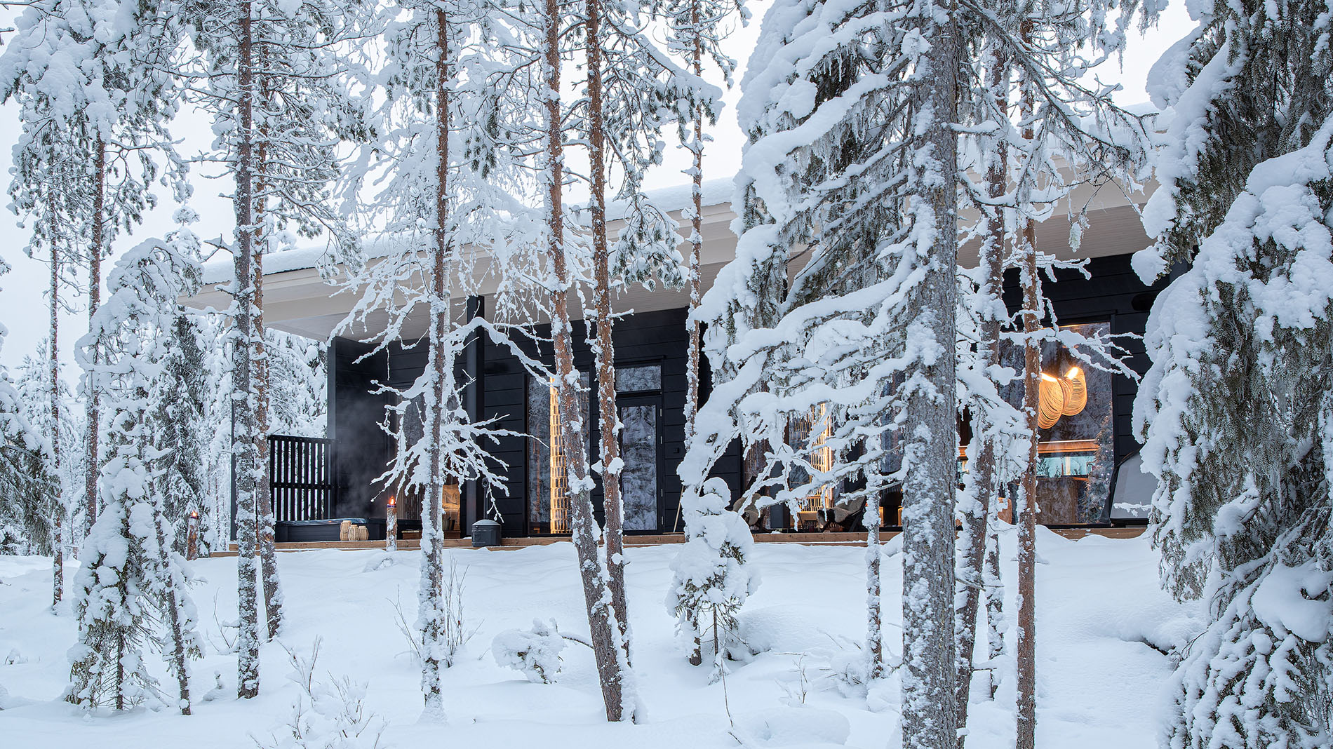 Hidden Arctic Cloud -villa behind the wintery forest. | Lapland Luxury