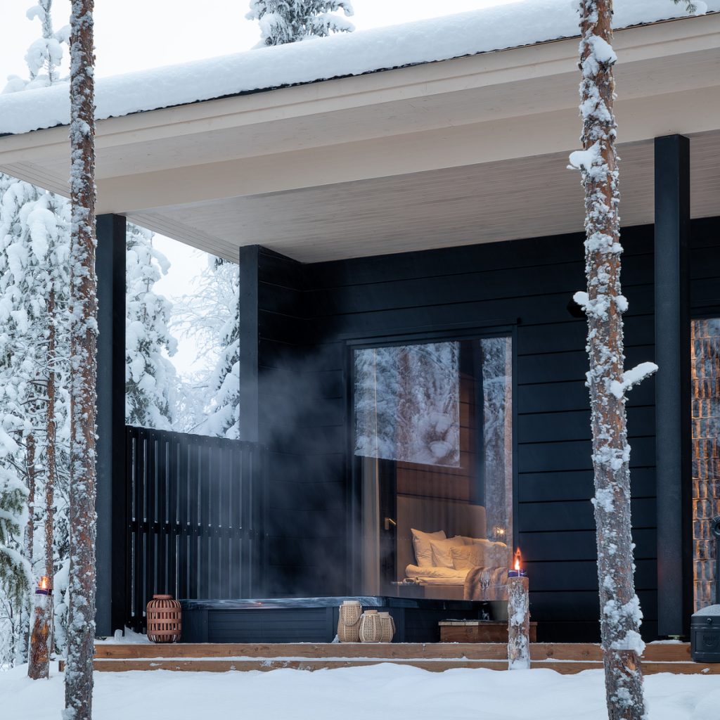 A view from the lakeside to the patio of the private Hidden Arctic Cloud villa. Lapland Luxury.