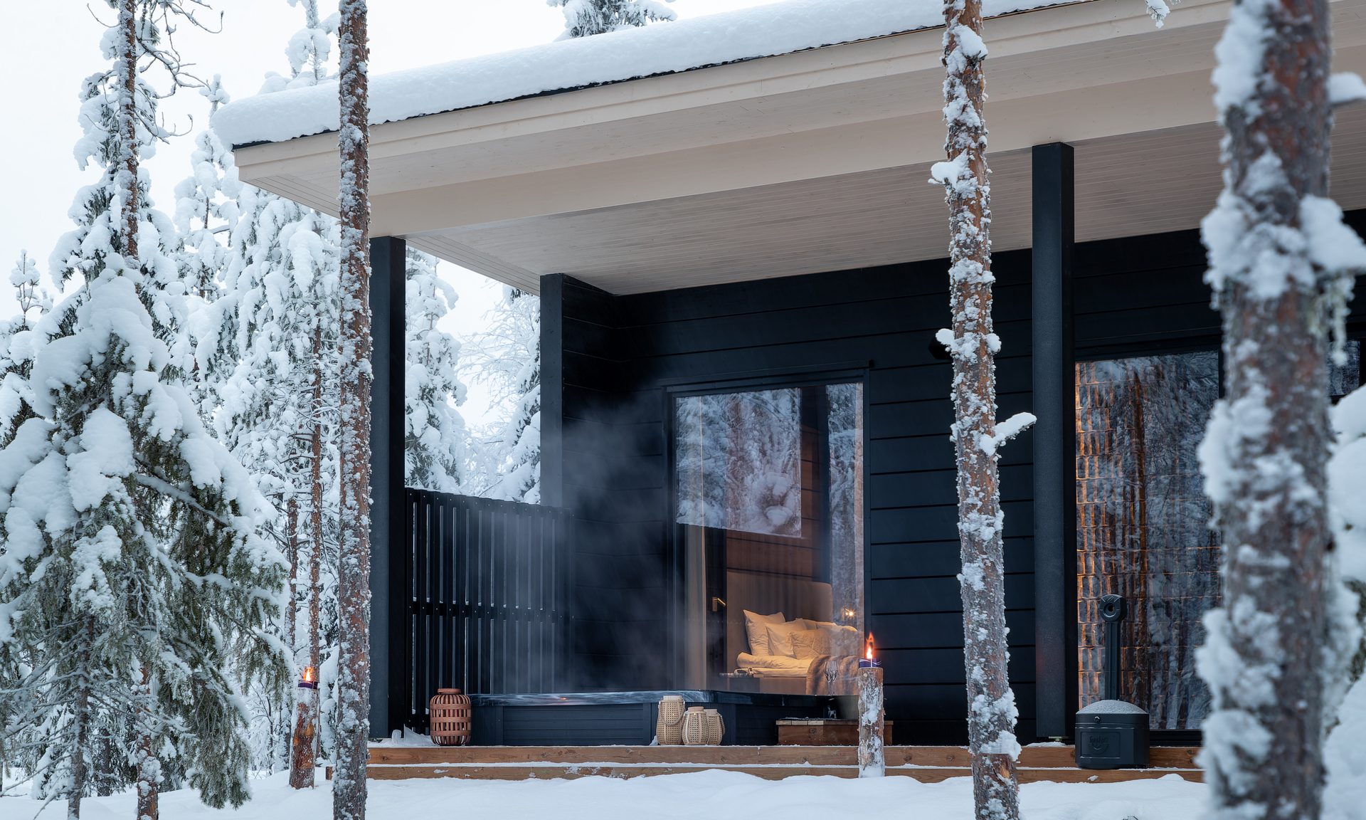 A view from the lakeside to the patio of the private Hidden Arctic Cloud villa. Lapland Luxury.